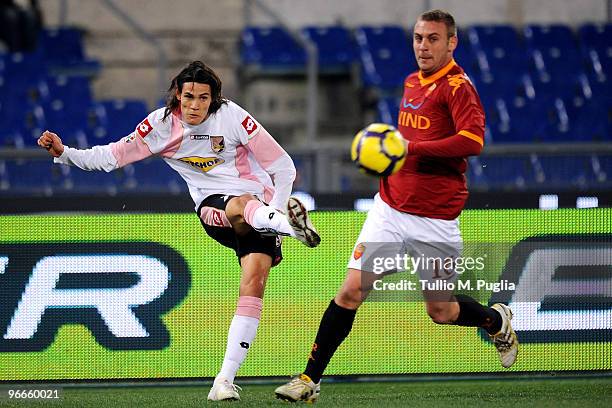 Edinson Cavani of Palermo and Daniele De Rossi of Roma compete for the ball during the Serie A match between AS Roma and US Citta di Palermo at...