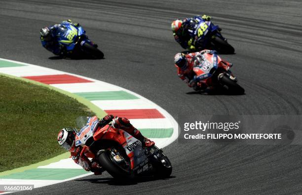 Ducati Team's Spanish rider Jorge Lorenzo leads Ducati Team's Italian rider Andrea Dovizioso, Movistar Yamaha's Italian rider Valentino Rossi and...