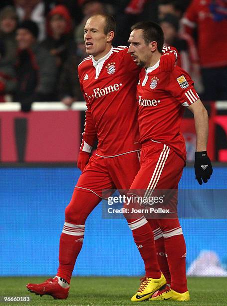 Arjen Robben of Bayern celebrates with his team mate Frank Ribery after scoring his team's second goal during the Bundesliga match between FC Bayern...