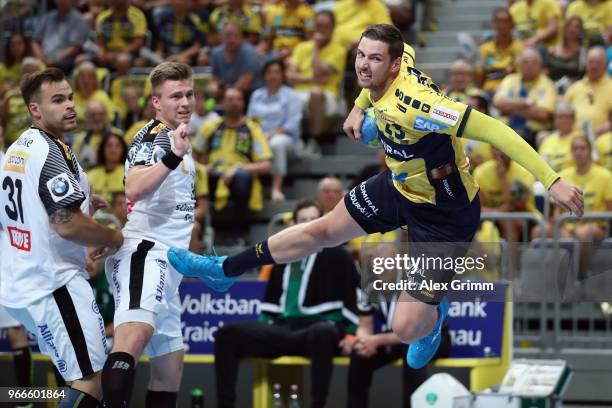 Hendrik Pekeler of Rhein-Neckar Loewen attempts to score during the DKB HBL match between Rhein-Neckar Loewen and DHfK Leipzig at SAP Arena on June...