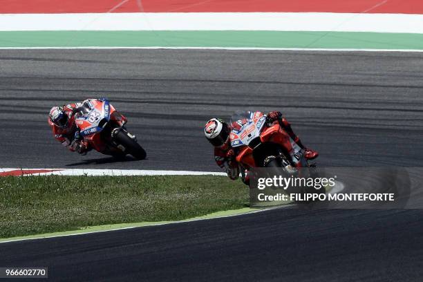 Ducati Team' Spanish rider Jorge Lorenzo leads Ducati Team's Italian rider Andrea Dovizioso during the Moto GP Grand Prix at the Mugello race track...