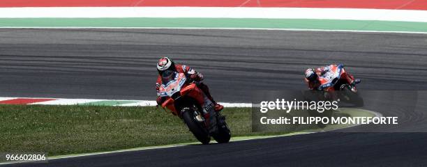 Ducati Team' Spanish rider Jorge Lorenzo leads Ducati Team's Italian rider Andrea Dovizioso during the Moto GP Grand Prix at the Mugello race track...