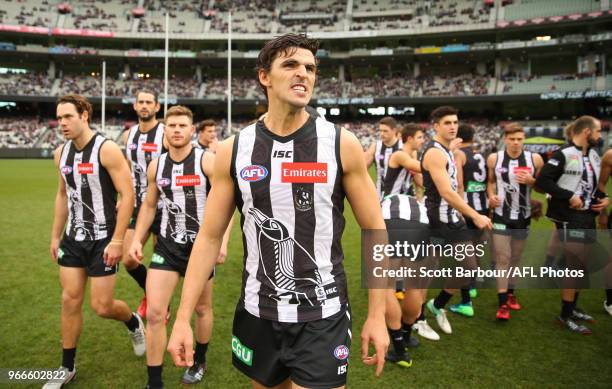 Scott Pendlebury of the Magpies speaks to his team during a quarter time break during the round 11 AFL match between the Collingwood Magpies and the...