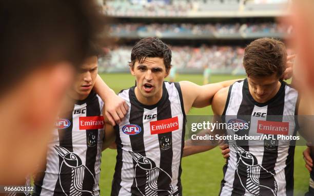 Scott Pendlebury of the Magpies speaks to his team during a quarter time break during the round 11 AFL match between the Collingwood Magpies and the...