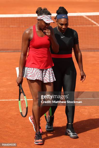 Venus Williams of The United States and partner Serena Williams in conversation during their ladies doubles fourth round match againstAndreja Klepac...