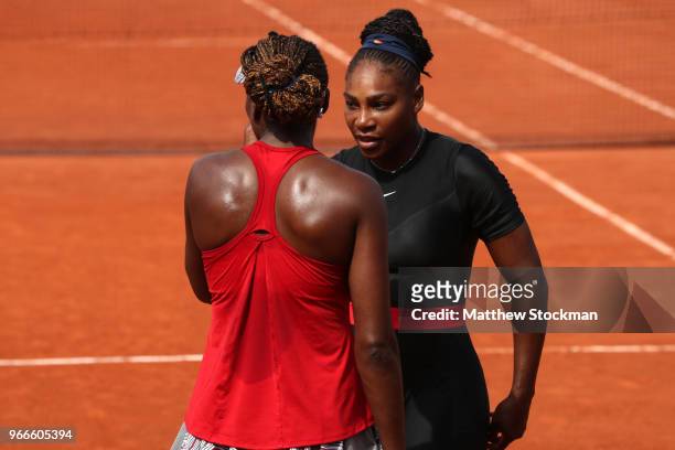Venus Williams of The United States and partner Serena Williams in conversation during their ladies doubles fourth round match againstAndreja Klepac...