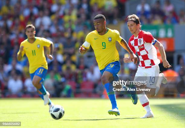 Gabriel Jesus of Brazil takes the ball away from Luke Modric of Croatia during the International Friendly match between Croatia and Brazil at Anfield...