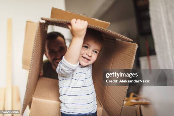 little boy moving into his new home - relocation stock pictures, royalty-free photos & images