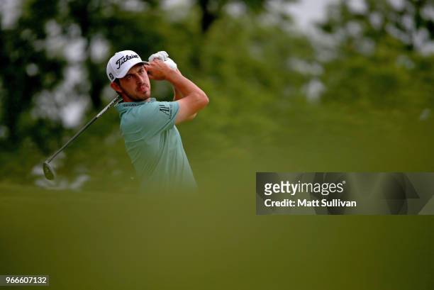 Patrick Cantlay watches his tee shot on the third hole during the final round of The Memorial Tournament Presented by Nationwide at Muirfield Village...