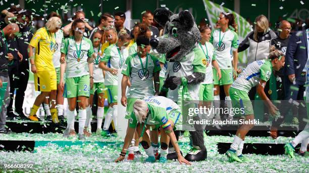 The Team of Wolfsburg celebrate the champion chip after the Allianz Frauen Bundesliga match between VfL Wolfsburg and 1. FC Koeln at AOK-Stadion on...