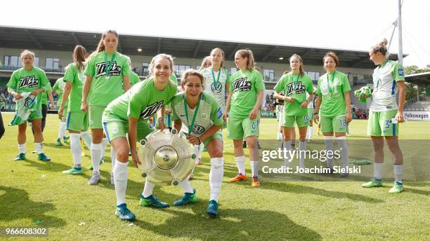 The Team with Lena Goessling and Anna Blaesse of Wolfsburg celebration the champion chip after the Allianz Frauen Bundesliga match between VfL...