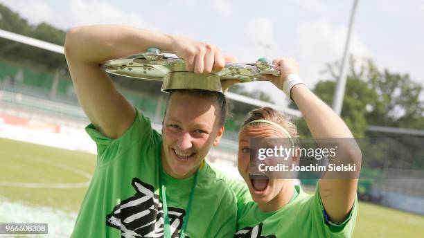 Almuth Schult and Alexandra Popp of Wolfsburg celebration the champion chip after the Allianz Frauen Bundesliga match between VfL Wolfsburg and 1. FC...