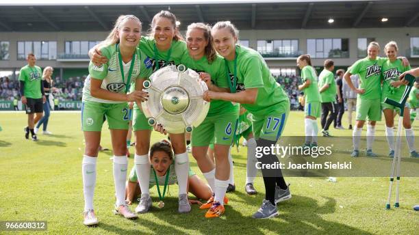 Joelle Wedemeyer, Sara Bjoerk Gunnarsdottir, Anna Blaesse, Katharina Baunach and Ewa Pajor of Wolfsburg celebration the champion chip after the...