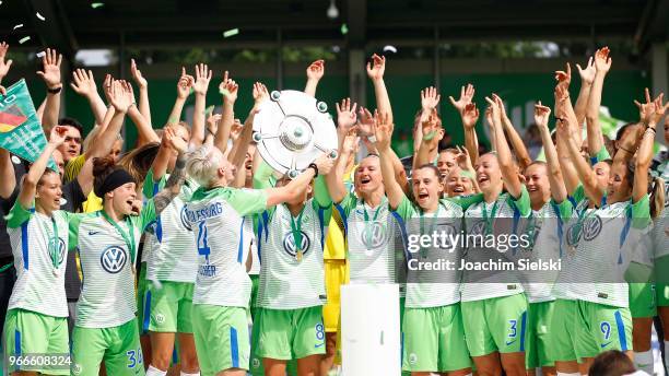 The Team of Wolfsburg celebrate the champion chip after the Allianz Frauen Bundesliga match between VfL Wolfsburg and 1. FC Koeln at AOK-Stadion on...