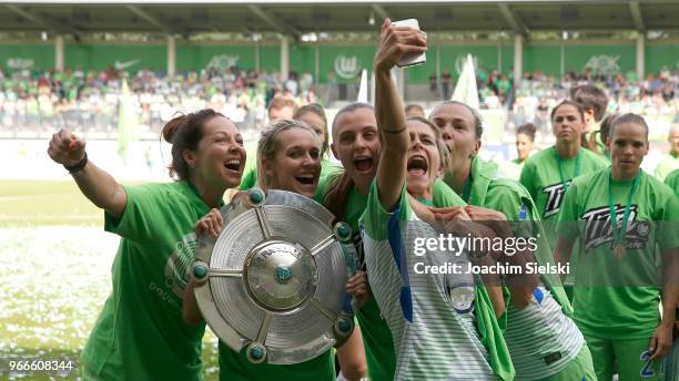 The Team of Wolfsburg celebrate the champion chip after the Allianz Frauen Bundesliga match between VfL Wolfsburg and 1. FC Koeln at AOK-Stadion on...