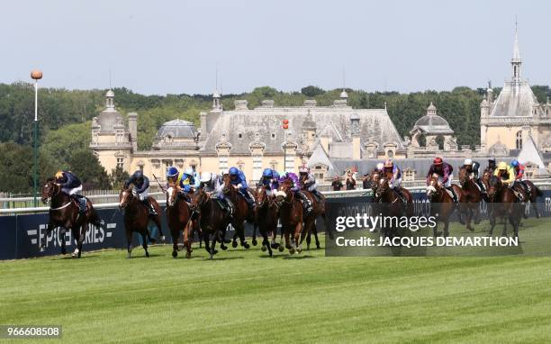 Jockeys rides their horses as they compete in the Prix du Jockey Club horse race at the Chantilly racecourse, north of Paris, on June 3, 2018.