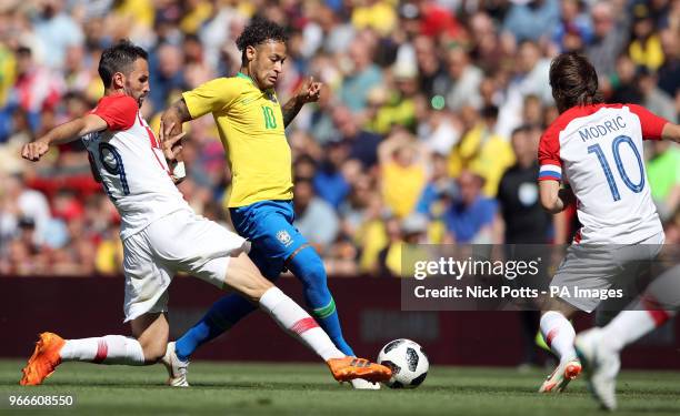 Brazil's Neymar battles for the ball with Croatia's Milan Badelj and Croatia's Luka Modric during the International Friendly match at Anfield,...