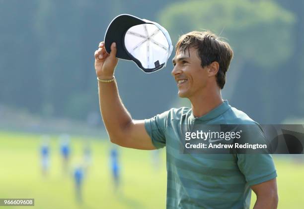 Thorbjorn Olesen of Denmark celebrates victory on the 18th green during the final round of the Italian Open at Gardagolf Country Club on June 3, 2018...
