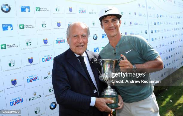 Franco Chimenti President of the Italian Golf Federation poses for a photo with the Winner of the Italian Open Thorbjorn Olesen of Denmark during the...