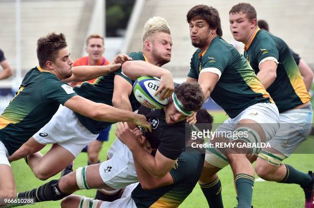 Irleand's number 8 and captain Caelan Doris scores a try during the Rugby Union World Cup U20 championship match between South Africa and Ireland at...