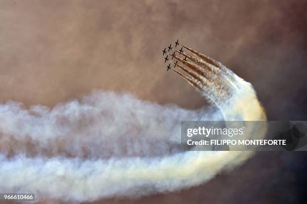 The Italian Air Force aerobatic unit Frecce Tricolori prepare to spread smoke with the colors of the Italian flag prior the Moto GP Grand Prix at the...