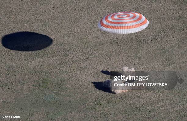 Russian Soyuz MS-07 space capsule lands about 150 km south-east of the Kazakh town of Dzhezkazgan, on June 3, 2018. - A Soyuz space capsule with...