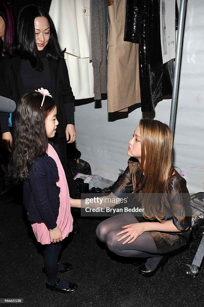 Model Pinterest Debb Designer Debb Yoon and actress/model Devin Aoki pose backstage at the ...