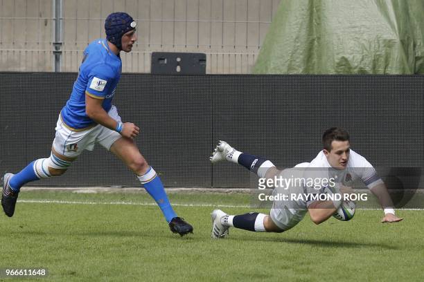 England's fullback Tom Parton scores a try during the Rugby Union World Cup U20 between England and Italy at the Aime Giral Stadium in Perpignan,...
