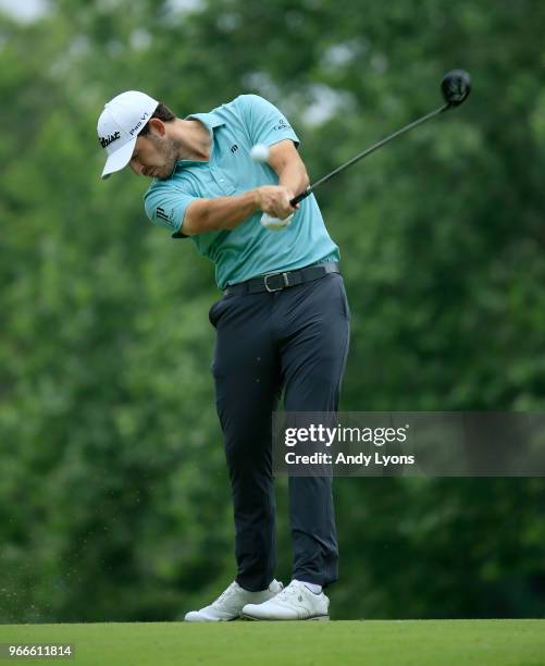 Patrick Cantlay watches his tee shot on the fifth hole during the final round of The Memorial Tournament Presented by Nationwide at Muirfield Village...