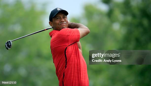 Tiger Woods watches his tee shot on the fifth hole during the final round of The Memorial Tournament Presented by Nationwide at Muirfield Village...