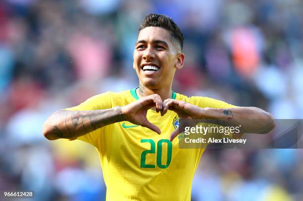 Firmino of Brazil celebrates after scoring his sides second goal during the International Friendly match between Croatia and Brazil at Anfield on...