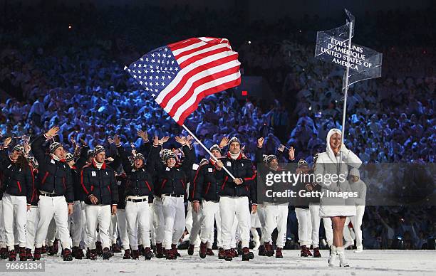 Team United States lead by Mark Grimmette enters the stadium during the Opening Ceremony of the 2010 Vancouver Winter Olympics at BC Place on...
