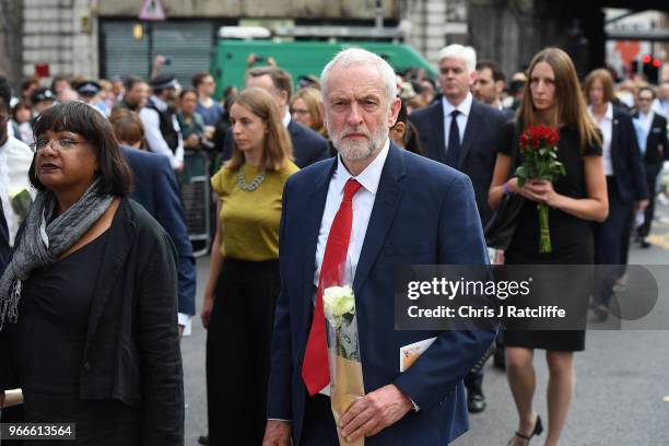 Leader of the Labour Party, Jeremy Corbyn walks next to Shadow Home Secretary Diane Abbott as he makes his way to lay flowers at the corner of London...