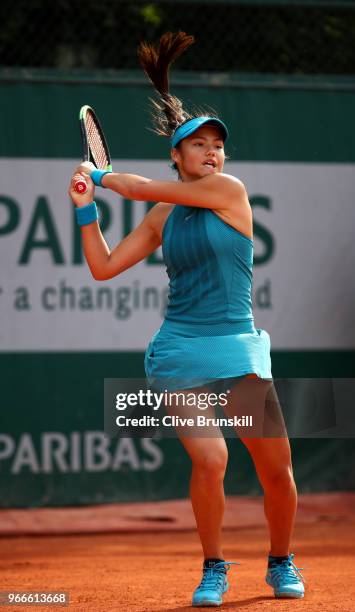 Emma Raducanu of Great Britain in action during the girls singles first round match againstMaria Timofeeva of Russia during day eight of the 2018...