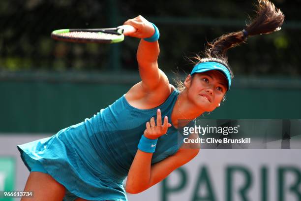 Emma Raducanu of Great Britain in action during the girls singles first round match againstMaria Timofeeva of Russia during day eight of the 2018...