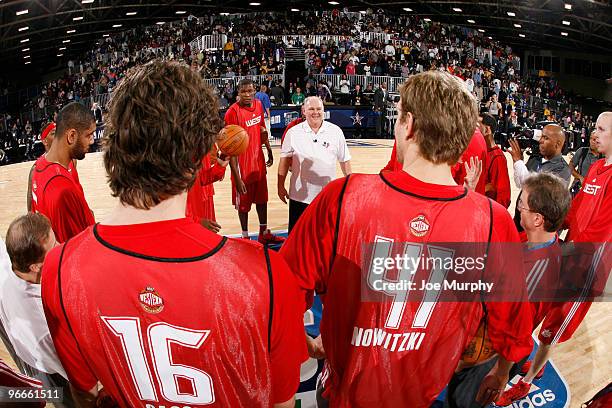 George Karl Head Coach of the Denver Nuggets talks to players during the All-Star Practice on center court at Jam Session presented by Adidas during...