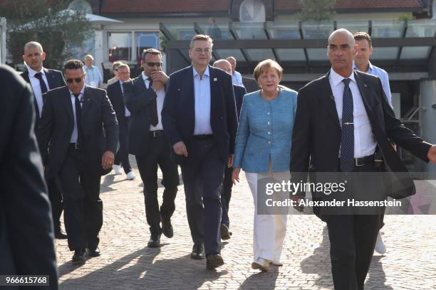 German Chancellor Angela Merkel arrives with DFB president Reinhard Grindel at the team hotel Hotel Weinegg of the German national team a during her...