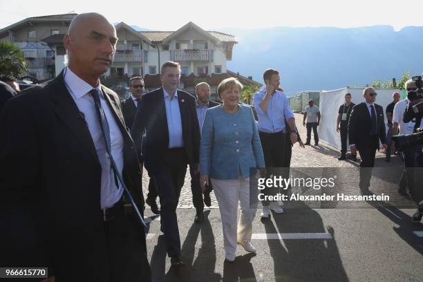 German Chancellor Angela Merkel arrives with DFB president Reinhard Grindel at the team hotel Hotel Weinegg of the German national team a during her...