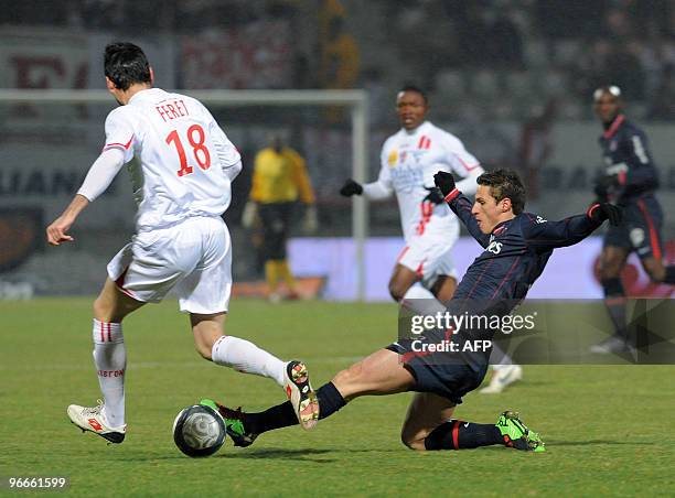 Nancy's midfielder Julien Feret vies with Paris Saint Germain's midfielder Christophe Jallet during their French L1 football match nancy vs Paris...