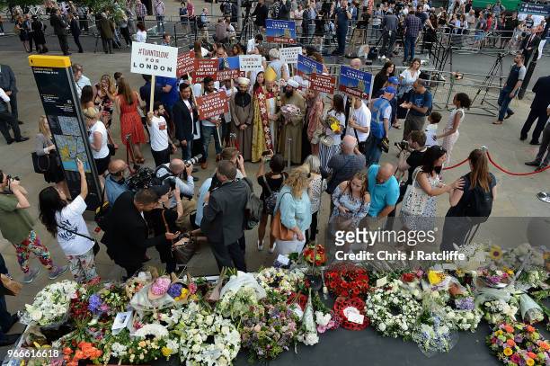 Members of the public lay flowers after the minute's silence at the corner of London Bridge on the first anniversary of the London Bridge terror...