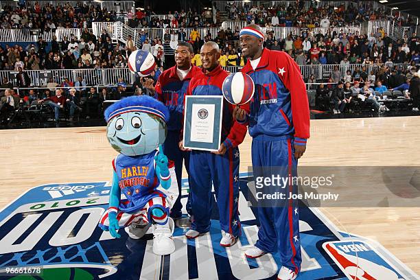 Scooter Christensen, Special K Daley and Bucket Blakes of the Harlem Globetrotters celebrates their Guinness World Book of Records during the...