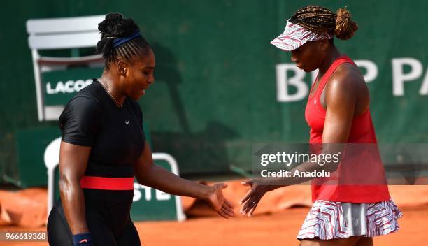 Venus Williams and Serena Williams of the USA in action against Andreja Klepac of Slovenia and Maria Jose Martinez Sanchez of Spain during during...