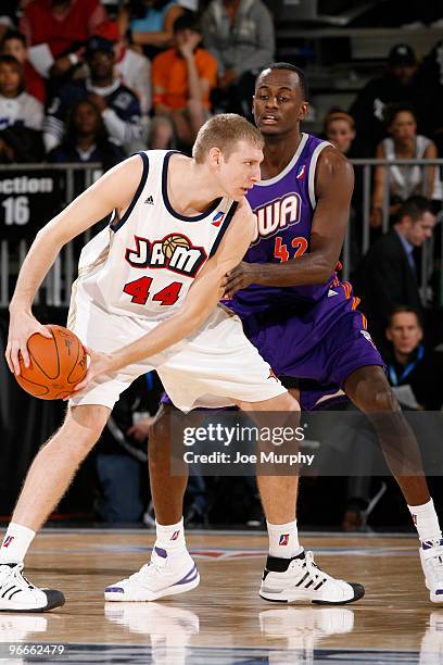 Brian Butch of the West All-Star Team drives Earl Barron of the East All-Star Team the ball past during the NBA D-League All-Star Game on center...