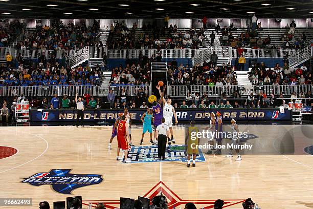 Earl Barron of the East All-Star Team tips-off against Dwayne Jones of the West All-Star Team during the NBA D-League All-Star Game on center court...