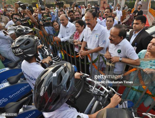 Vice President Venkaiah Naidu interacts with cyclists before flagging off a cycle rally on the occasion of World Bicycle Day 2018 in the presence of...