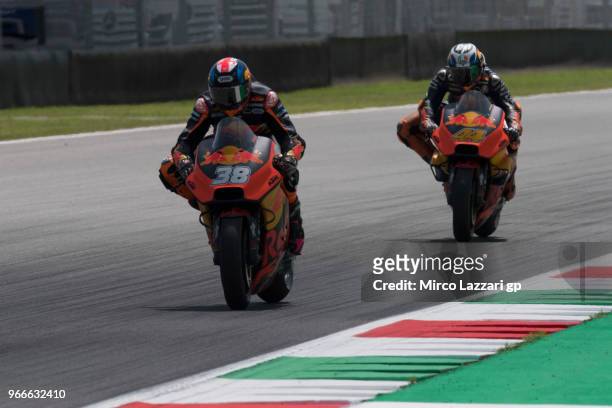 Bradley Smith of Great Britain and Red Bull KTM Factory Racing leads Pol Espargaro of Spain and Red Bull KTM Factory Racing during the MotoGP race...