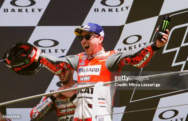 Jorge Lorenzo of Spain and Ducati Team celebrates the victory on the podium at the end of the MotoGP race during the MotoGp of Italy - Race at...