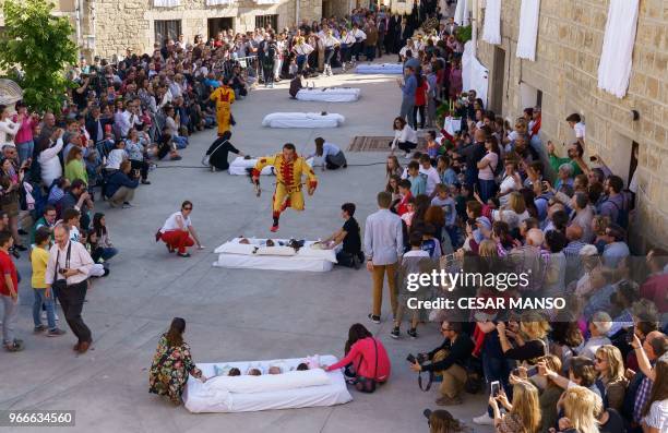 The 'Colacho' jumps over babies during 'El salto del Colacho', the baby jumping festival in the village of Castrillo de Murcia, near Burgos on June...