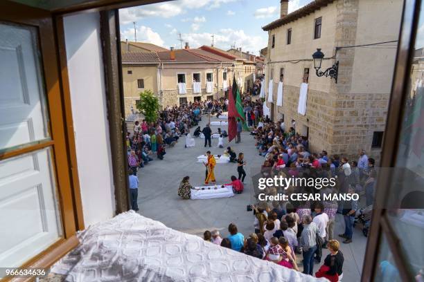 People attend 'El salto del Colacho', the baby jumping festival in the village of Castrillo de Murcia, near Burgos on June 3, 2018 - Baby jumping is...