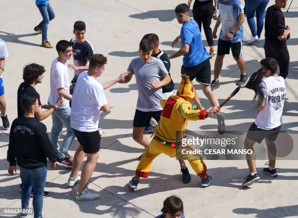 Colacho' chases people during 'El salto del Colacho', the baby jumping festival in the village of Castrillo de Murcia, near Burgos on June 3, 2018 -...